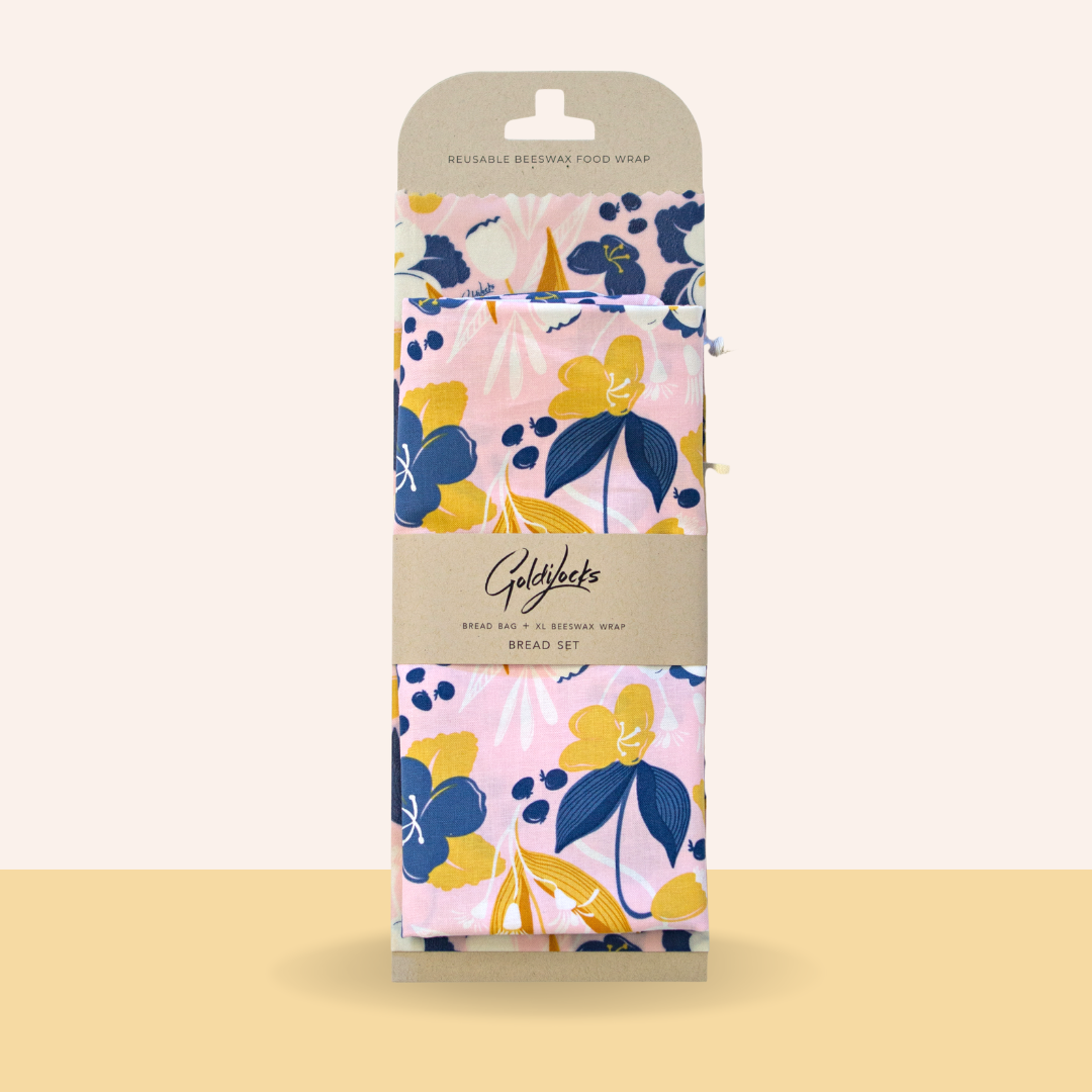 Floral patterned reusable food wrap set in packaging on a beige background