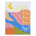 A colourful baby card with an abstract landscape design. It features a yellow moon and stars in the sky, a river, and various patterned hills in shades of orange, pink, blue, and green. White text on one of the orange hills reads "Baby Baby Baby!" and "Yay!" on a blue wavy section at the bottom.