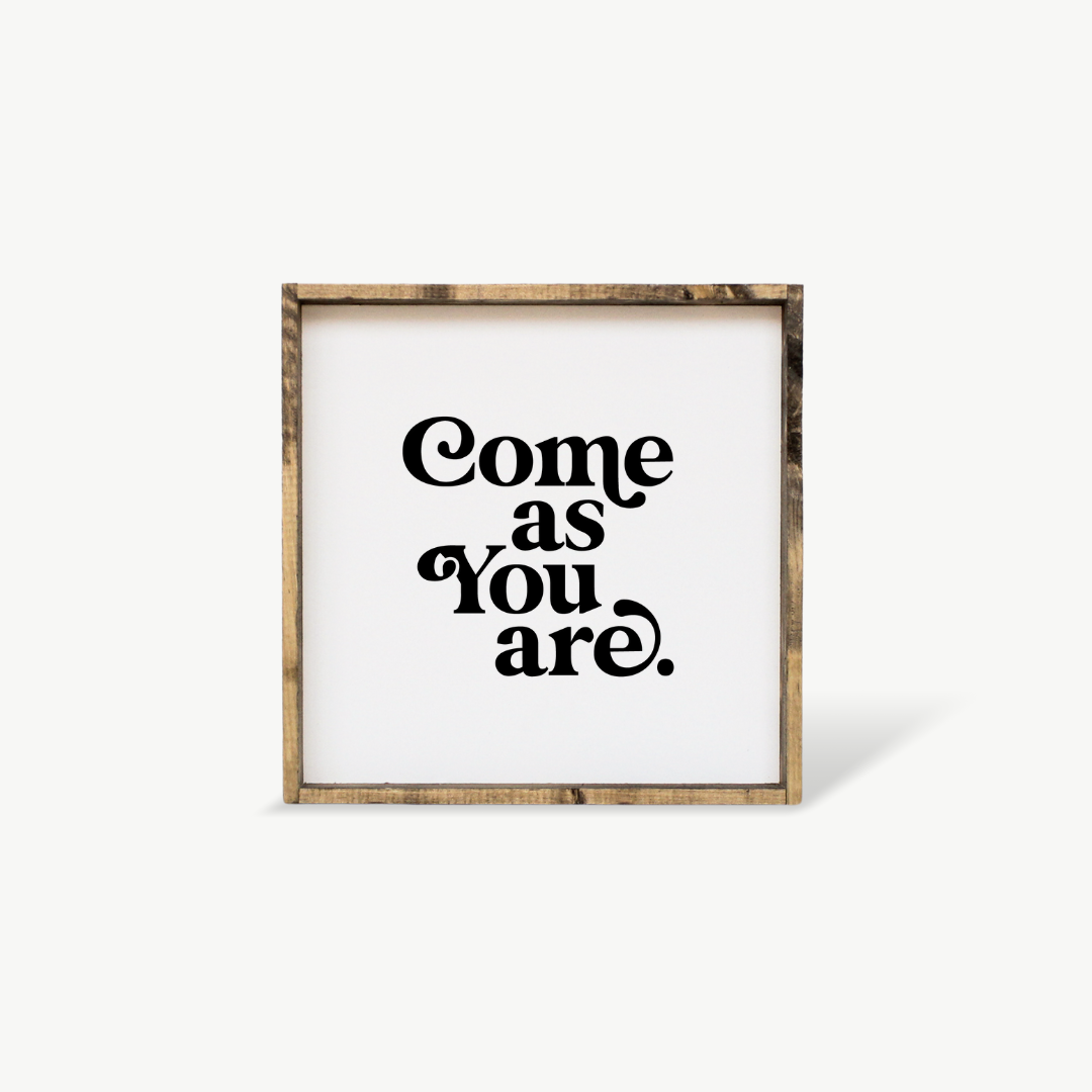 Framed print with 'Come as You Are' text on a white background