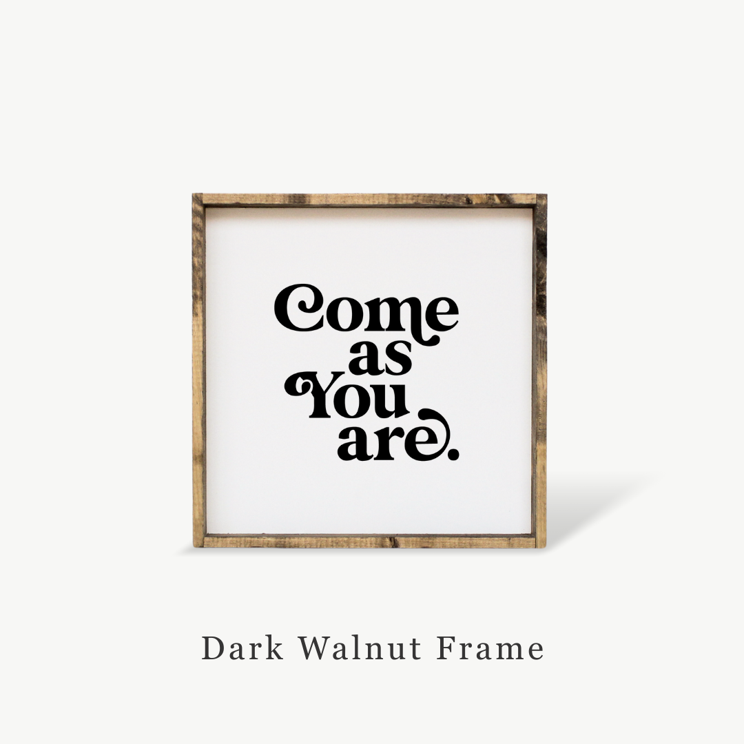 Framed print with 'Come as You Are' text on a white background