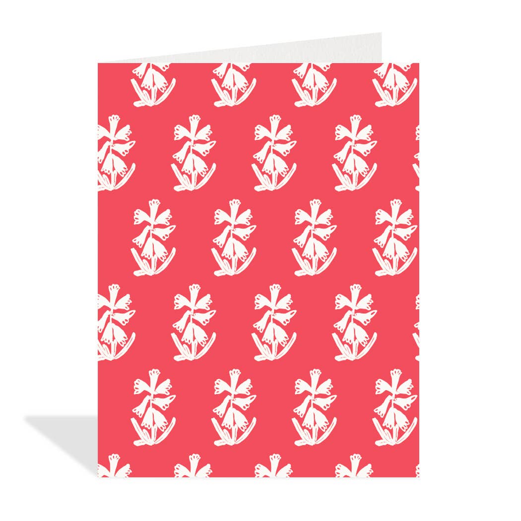 Greeting card with white floral pattern on a red background