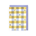 Checkered towel with floral patterns on a white background