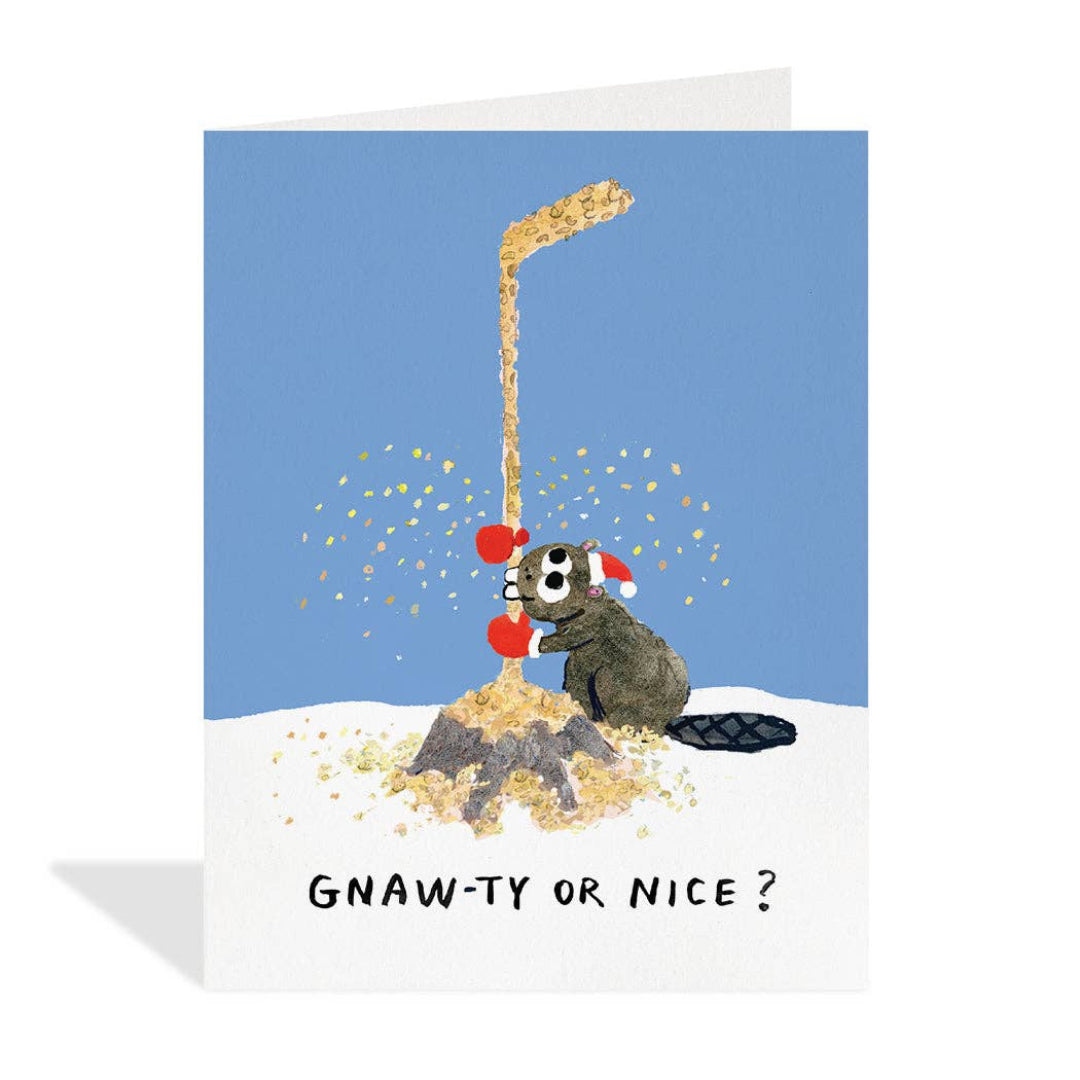 Greeting card with a cartoon beaver under a Christmas tree, asking 'Gnaw-ty or Nice?' on a blue background.