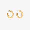 Gold hoop earrings on a white background