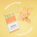 An image of the Beeswax Wrap Variety Set and one being used in an envelope style to store blueberries, with the text "keep your food fresh for longer".