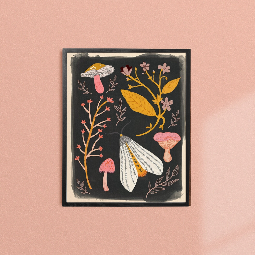 Nature Specimens Framed Art Print, a black art print with pink and gold images of mushrooms, and florals, in a black frame.