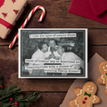 Christmas-themed card with humorous quote on a wooden surface with gingerbread cookies and candy canes.
