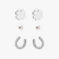 Set of silver flower and horseshoe earrings with pearls on a white background