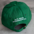 Green cap with text 'WITH MINOR INCONVENIENCES' on a gray surface