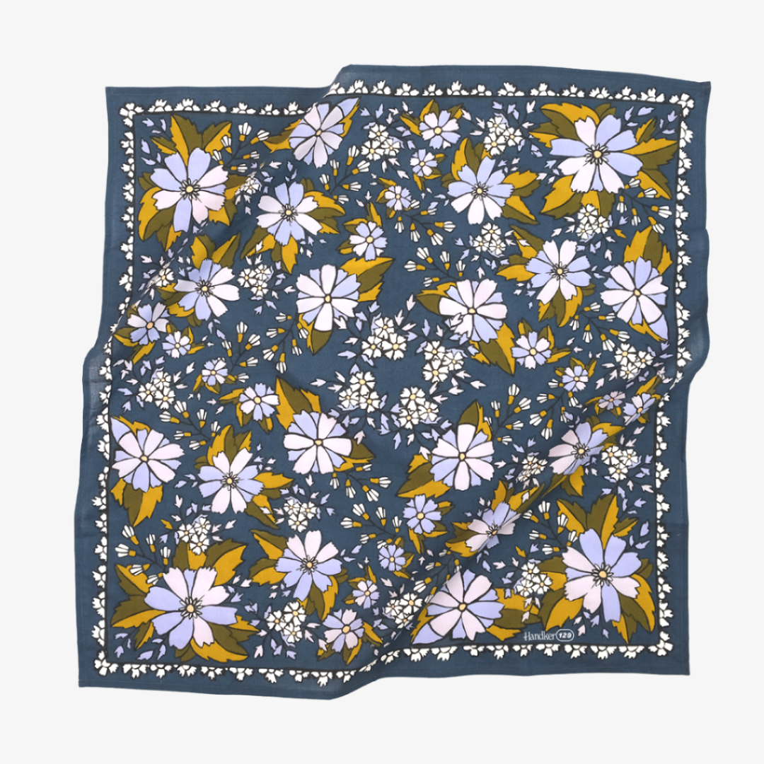Floral patterned fabric square on a white background