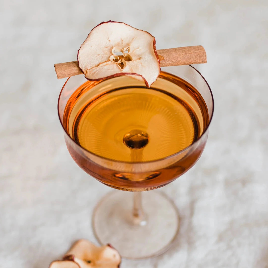 A clear plastic pouch containing a Maiden Voyage Orchard Mix. The pouch has a red background with a white label featuring the Maiden Voyage logo and the product name. The label also lists the ingredients: Apple, Cinnamon, Star Anise. 