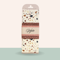Pack of Goldylocks beeswax food wraps with terrazzo pattern on a light green background