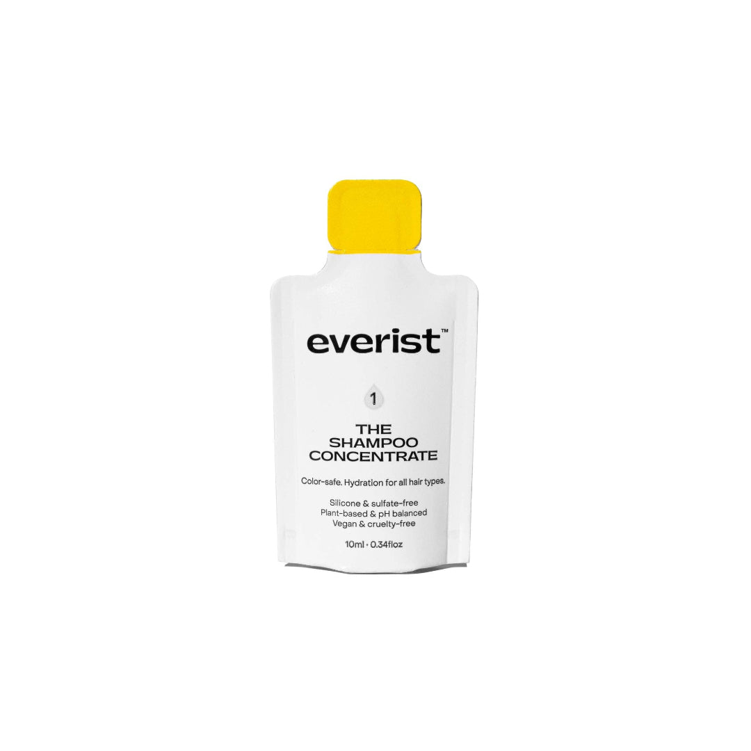Everist shampoo concentrate bottle with yellow cap on a white background