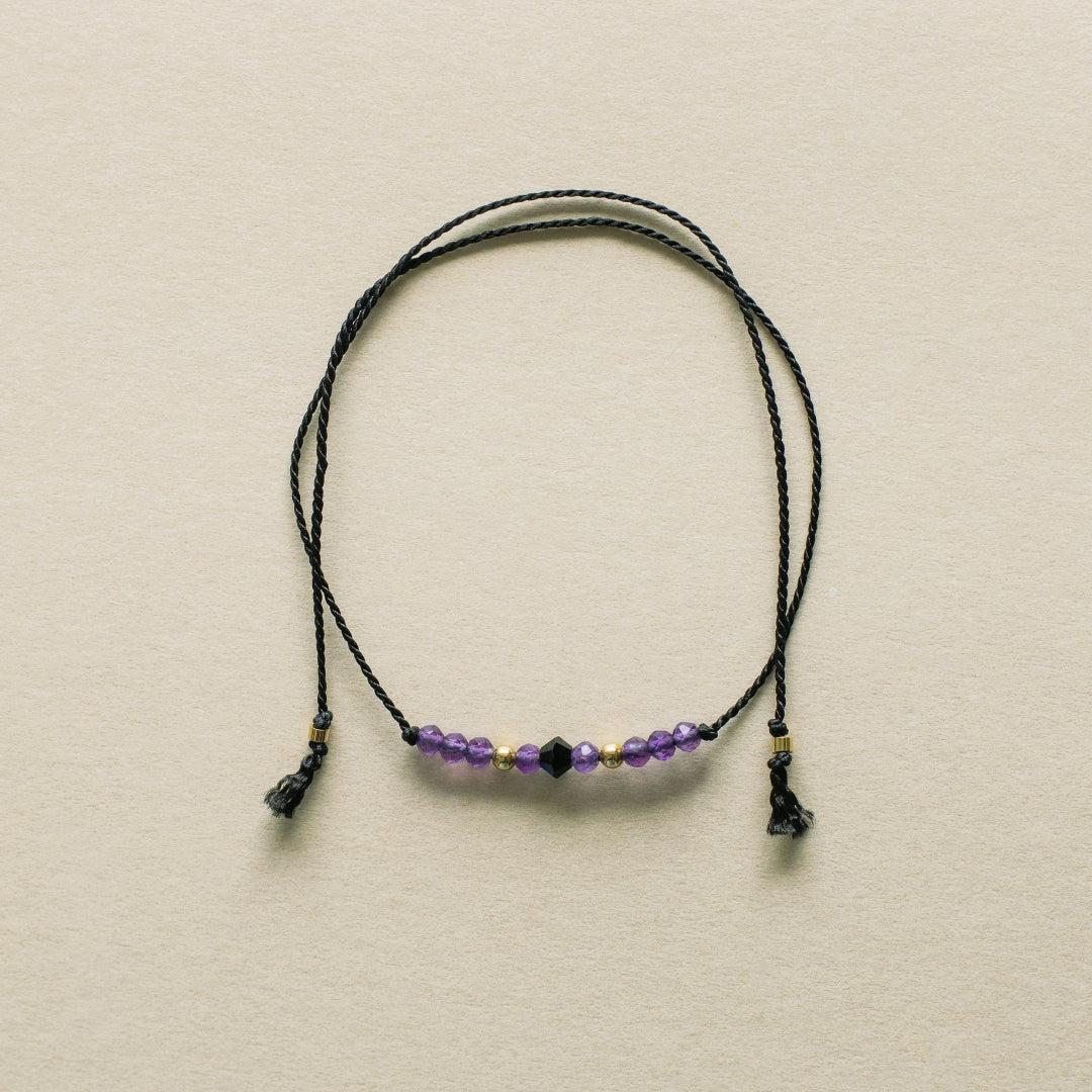 Necklace with beads on a beige background